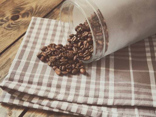 Jar of whole coffee beans for storage